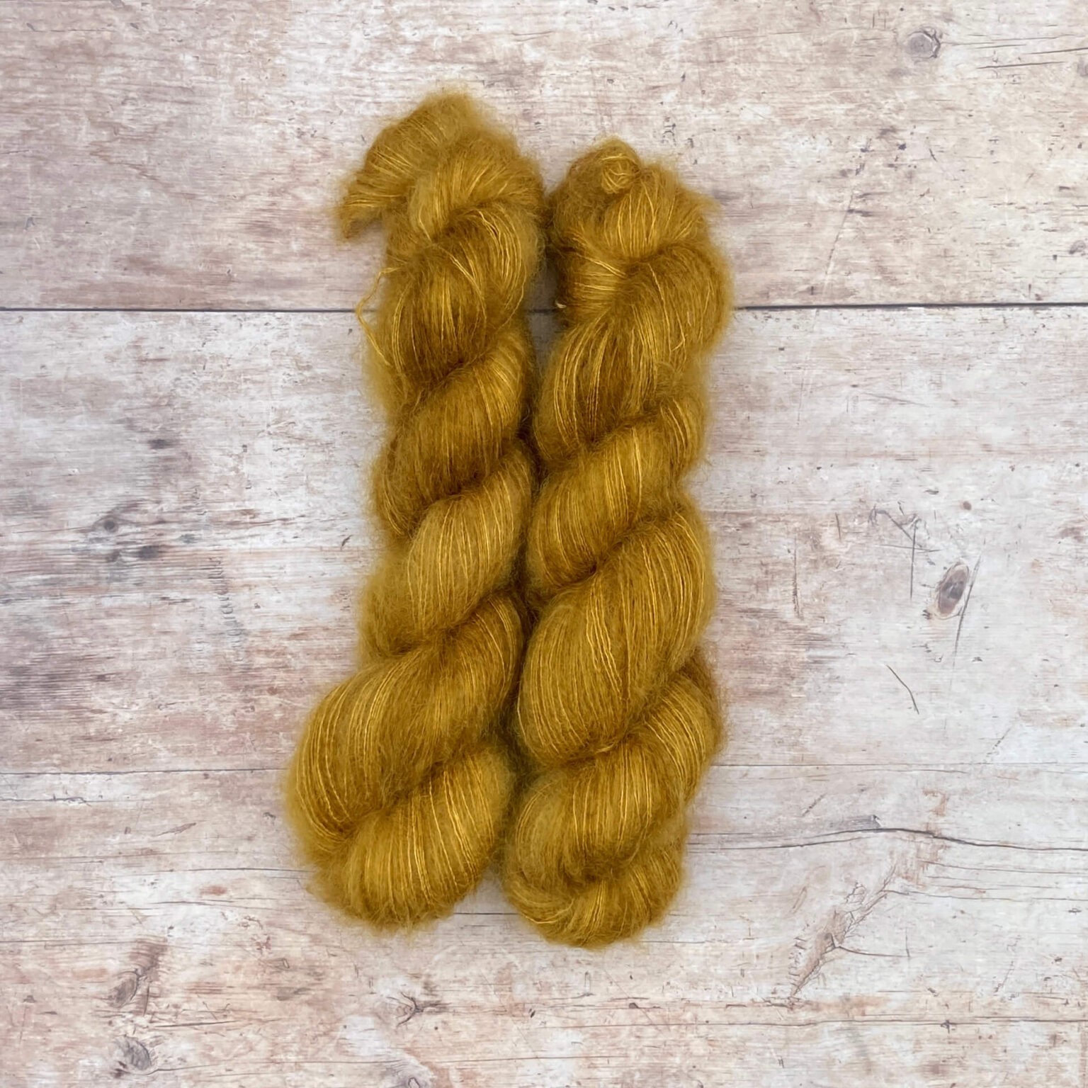 Two skeins of Mohair and silk lace in a deep rich gold