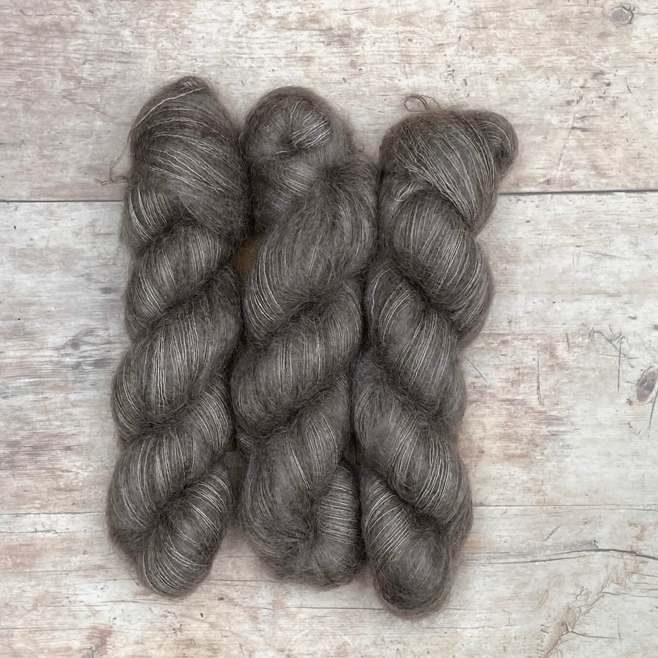 Three skeins of mink coloured mohair and silk lace
