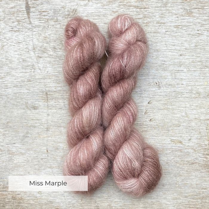 Two skeins of fluffy mohair in a dusky pink