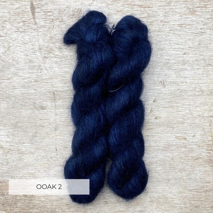 Two skeins of fluffy mohair in a deep dark blue