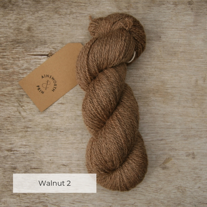 A single skein of warm brown yarn with a brown tie tag