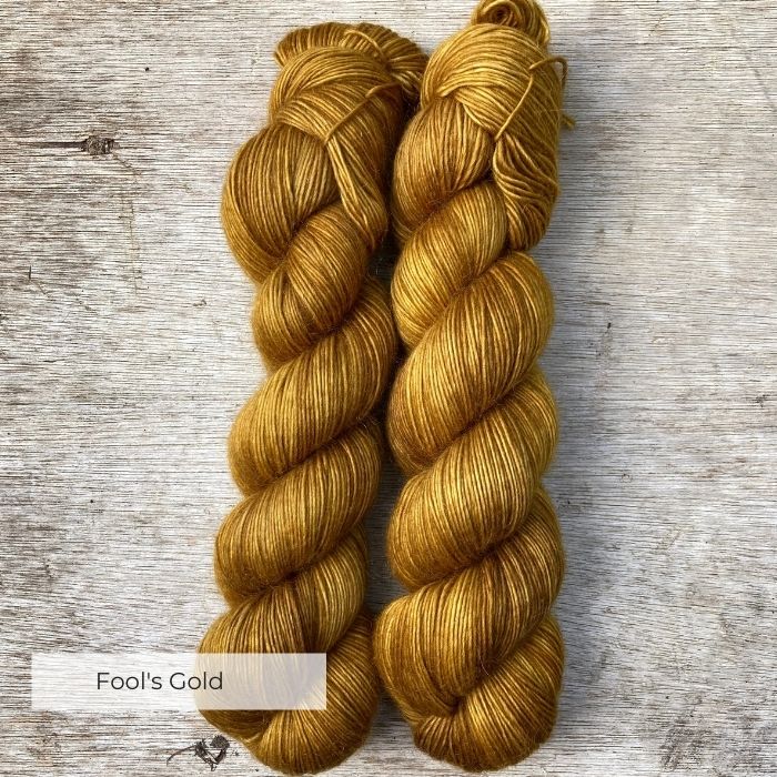 Two skeins of deep golden ochre yarn