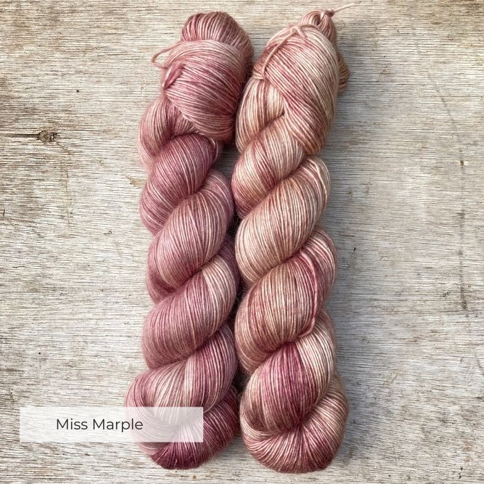 Two skeins of dusky pink yarn