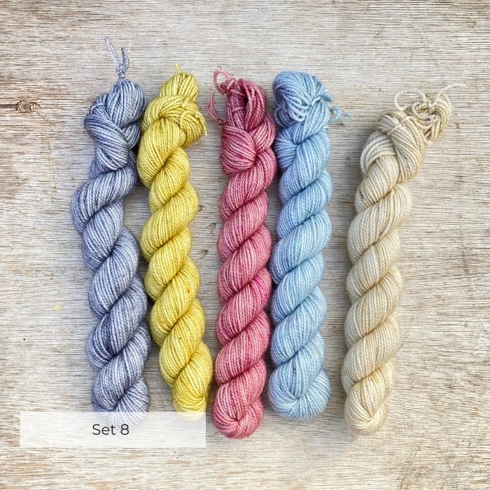 Five mini skeins of sock wool in lightly speckled pastels