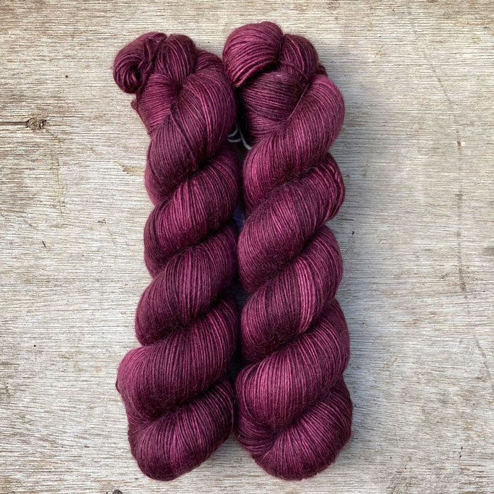 Two skeins of rich wine red yarn