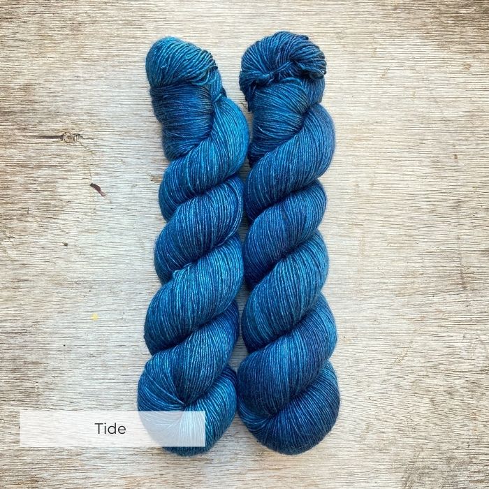 Two skeins of deep blue green
