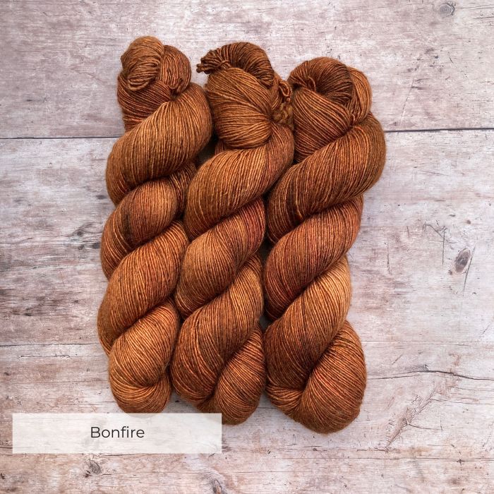 Three skeins of Merino Silk in a rich ginger with pink overtones