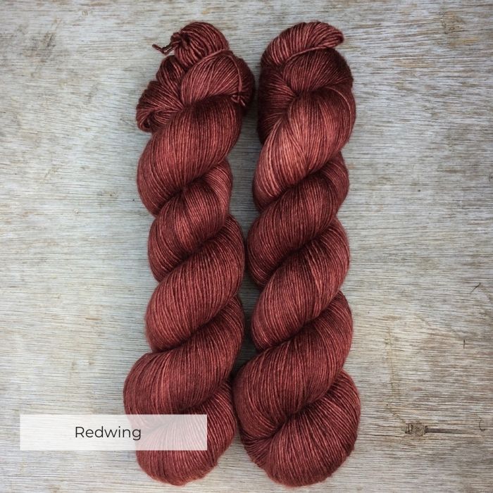 skeins of soft yarn in deep red