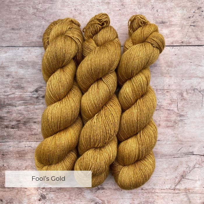 Three skeins of Merino Silk in a rich golden yellow