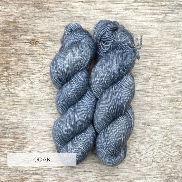 Two plump skeins of cool blue, grey yarn