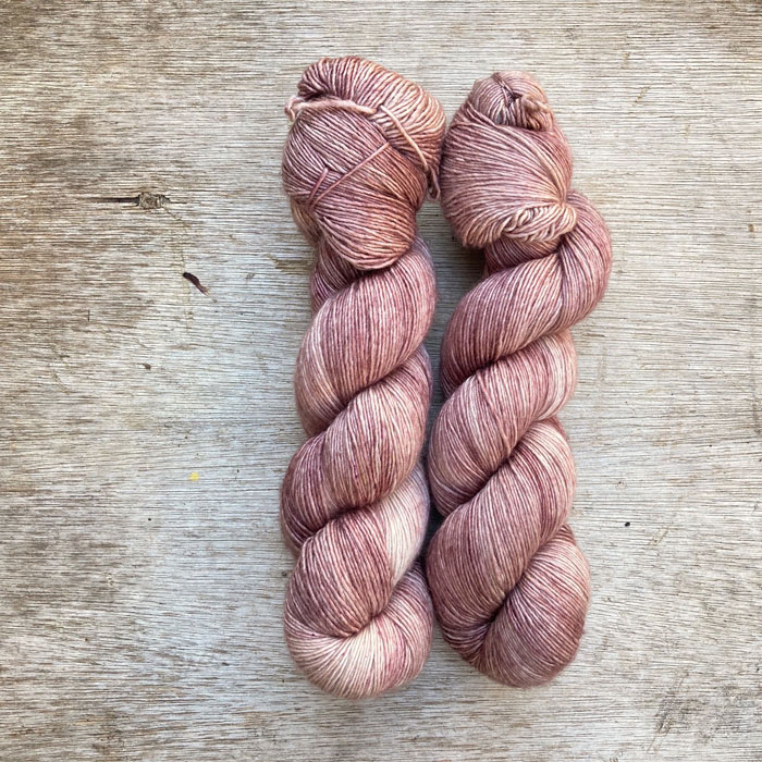 Two skeins of dusky pink yarn