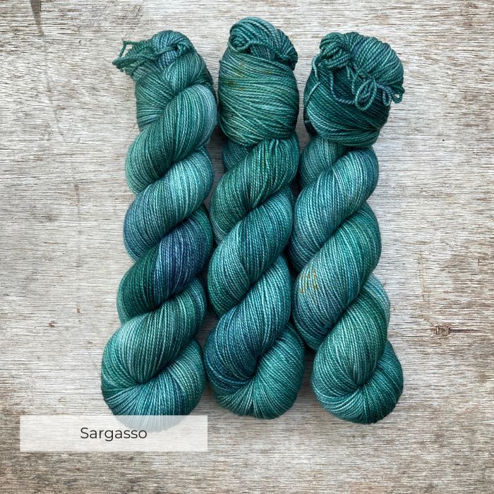 Three skeins of yarn in all the colours of the sea