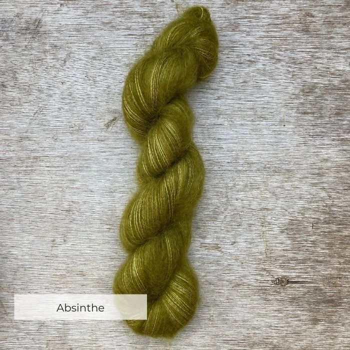A single skein of bright olive green mohair