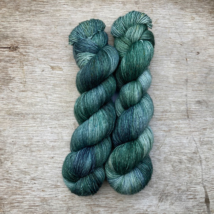 Two skeins of silky yarn in all the colours of the sea