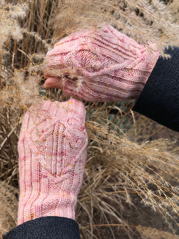 The backs of some fingerless mittens