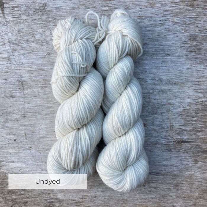 two skeins of undyed crazy white wool