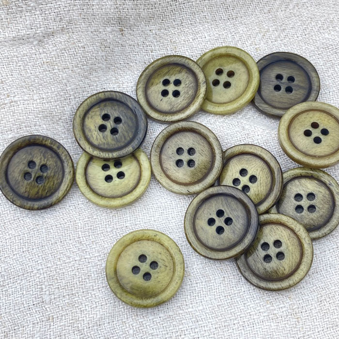 A scattering of green bone buttons