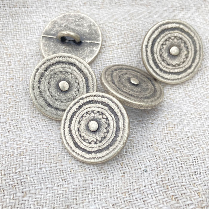Five old silver coloured metal shank buttons