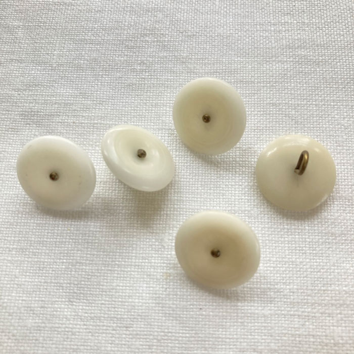 Five 15mm white corozo buttons with a bronze metal shank