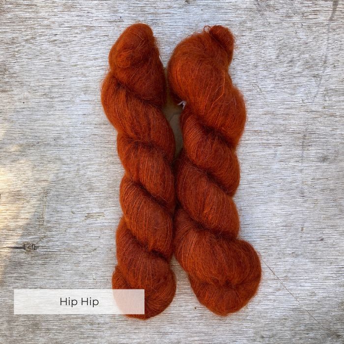 Two skeins of burnt orange mohair and silk lace