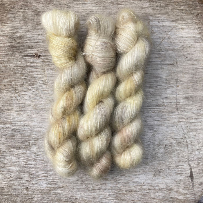 Three skeins of pale creamed mink mohair lace
