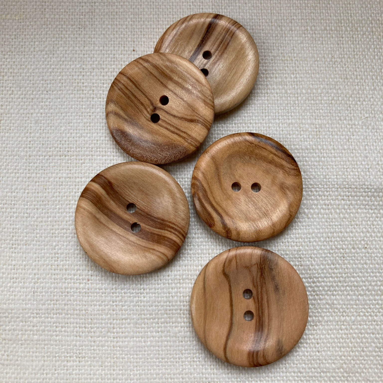 5 two hole rounded edge olive wood buttons