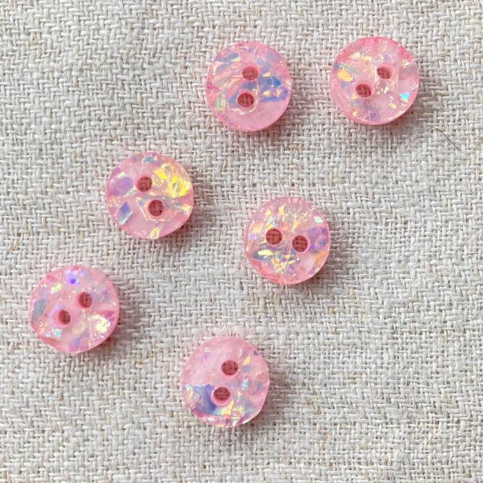 Six pink sparkly buttons