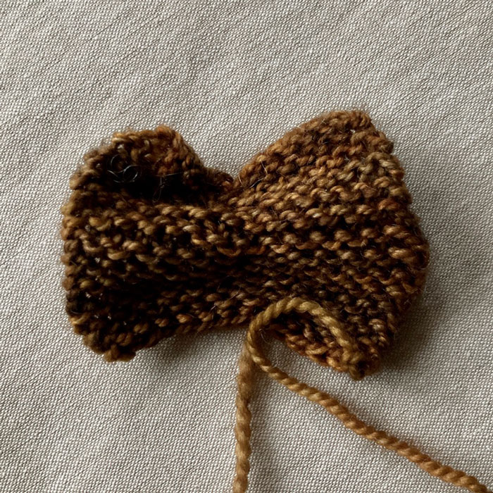a lightly gathered square of knitting