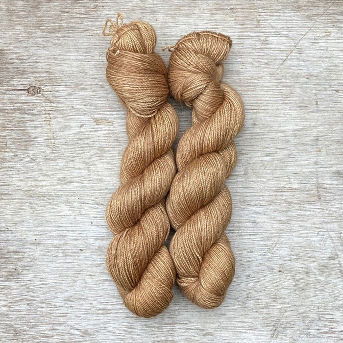 Two skeins of warm caramel coloured yarn