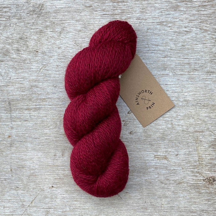 A single skein of deep blood red wool