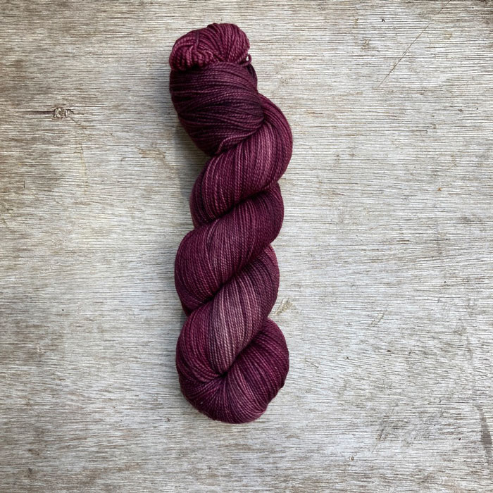 yarn in the colour of faded burgundy and plum
