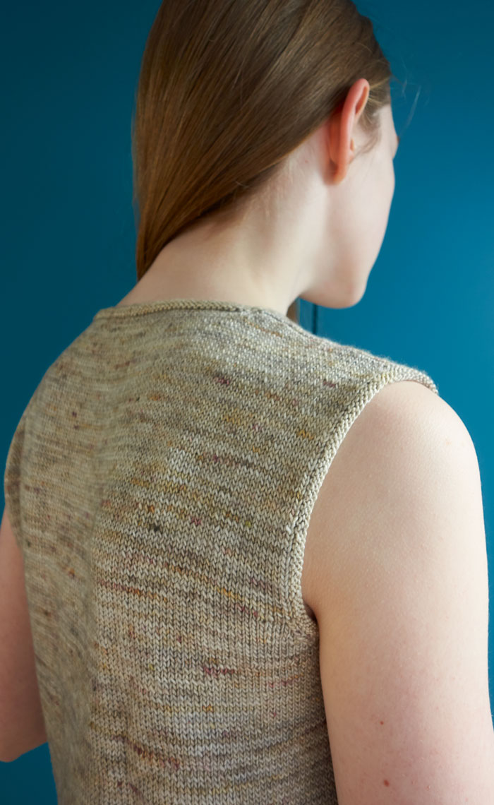 A close up of the shoulder and neck finish on a sleeveless top