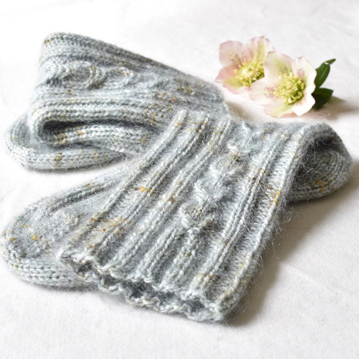 A pair of fluffy folded socks in palest blue