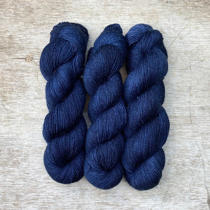 Three skeins of the deepest blue sock wool