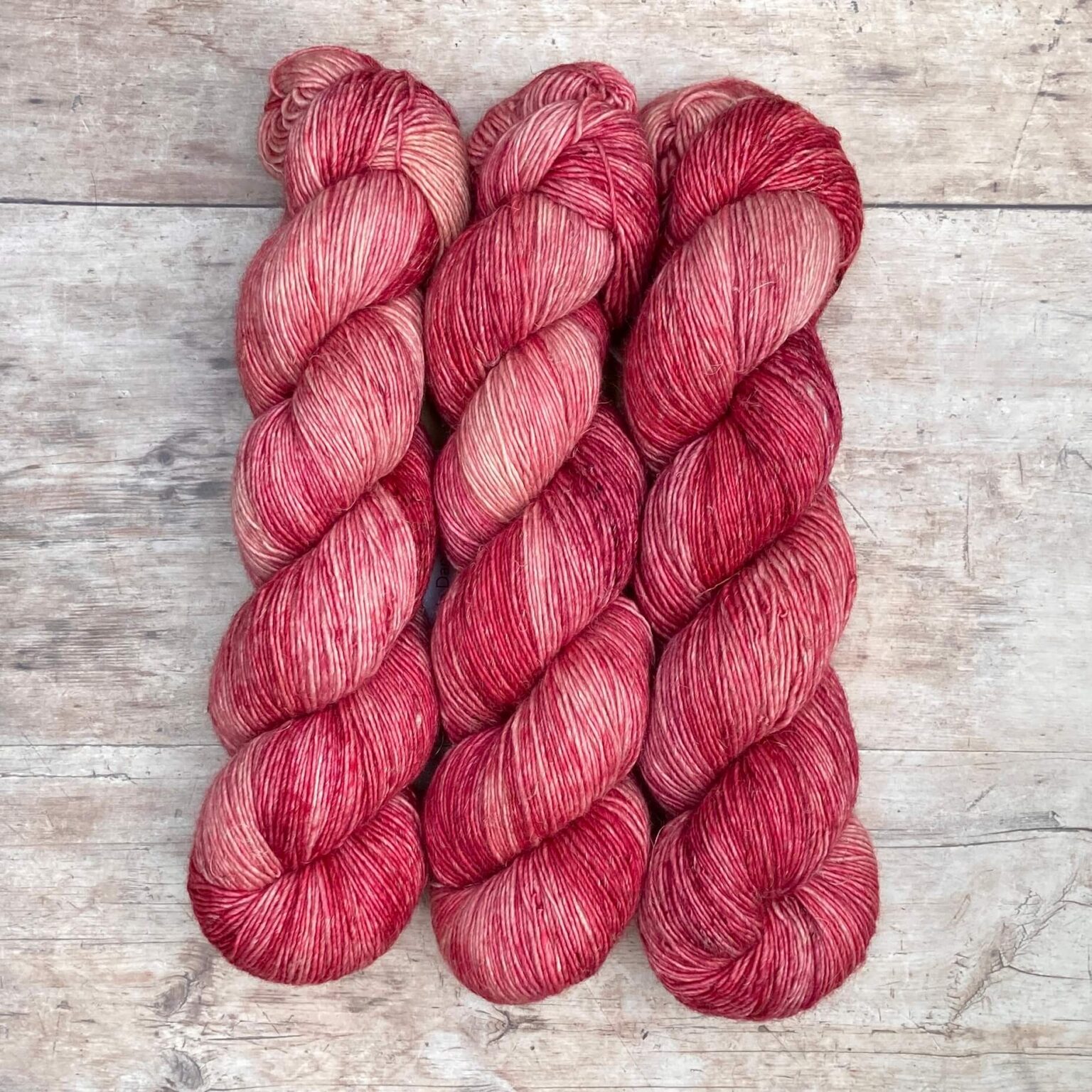 Variegated Flax yarn in mid to deep pink
