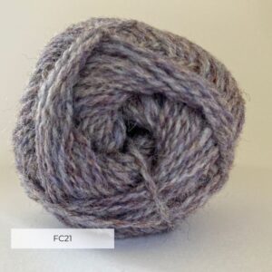 Close up of the end of a ball of wool in a soft marled lilac