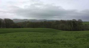A view across fields to the welsh hills