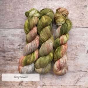 Three skeins of Merino & Silk in green, pink and soft grey