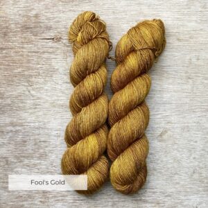 Two skeins of deep golden ochre yarn