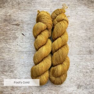 Two skeins of deep golden ochre yarn