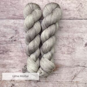 Two soft skeins of Merino Silk in a pale grey yarn