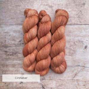 Two skeins of Merino & Silk in a pale terracotta