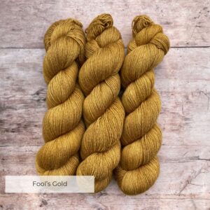 Three skeins of Merino Silk in a rich golden yellow