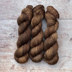 Three skeins of Merino & Silk in a rich deep brown