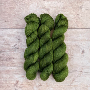 Three skeins of Merino & Silk Single in a forest green