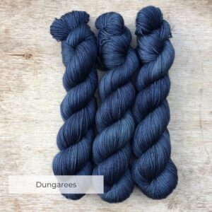Three skeins of dusky blue yarn