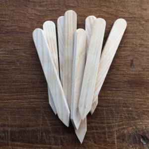 Pale birchwood labels on a rough beech block