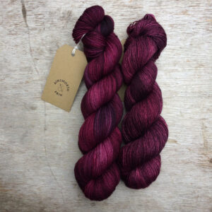 Two skeins of yarn in the same colour but different bases so they're slightly different