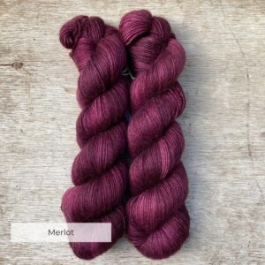 Two skeins of rich wine red yarn