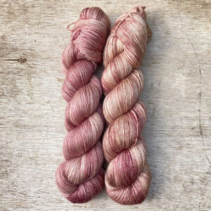 Two skeins of dusky pink yarn